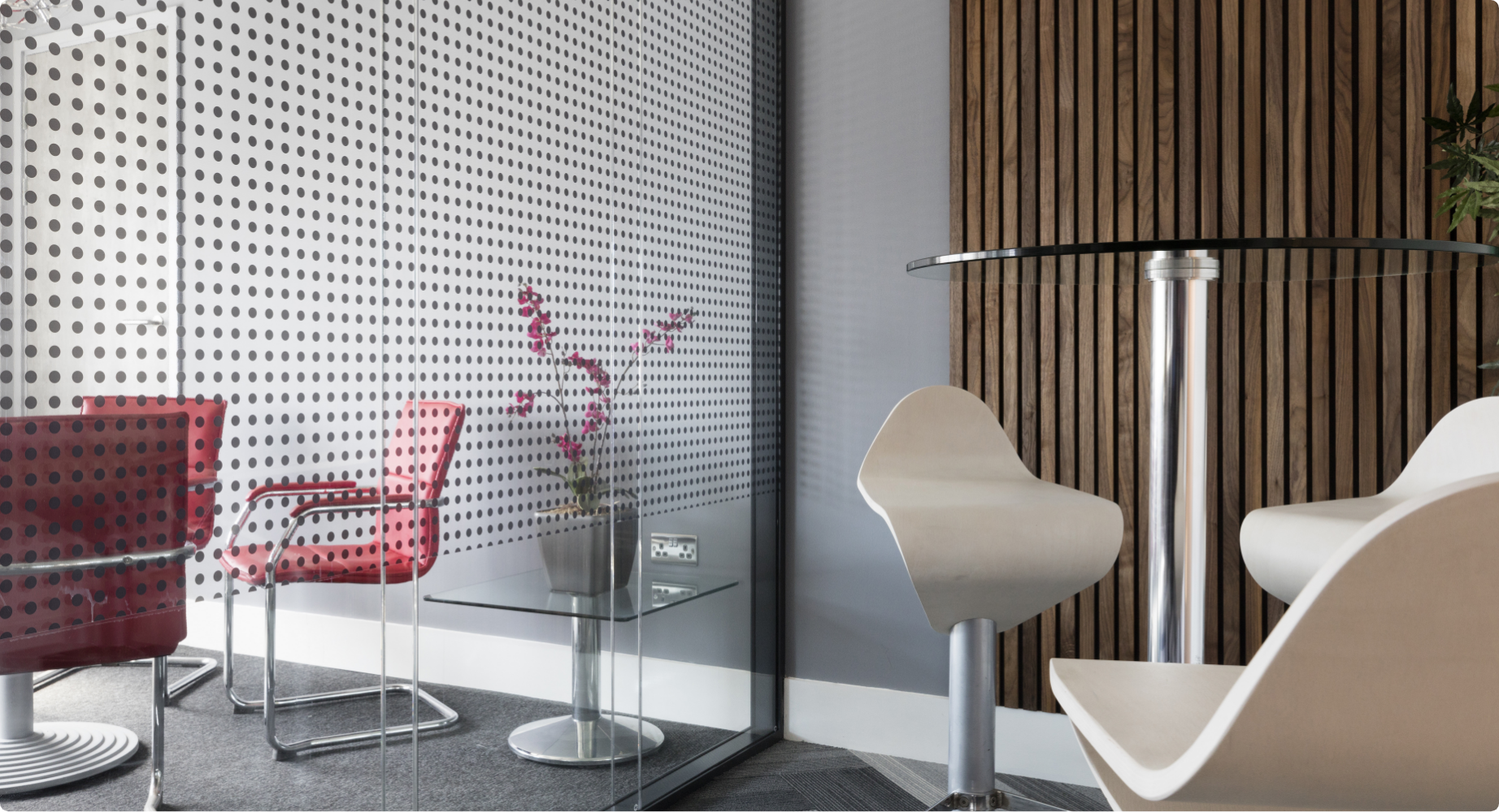 Space-efficient acoustic sliding door for a compact co-working space